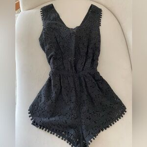 Black see-through jumpsuit with cuts for beach and summertime. Size XS